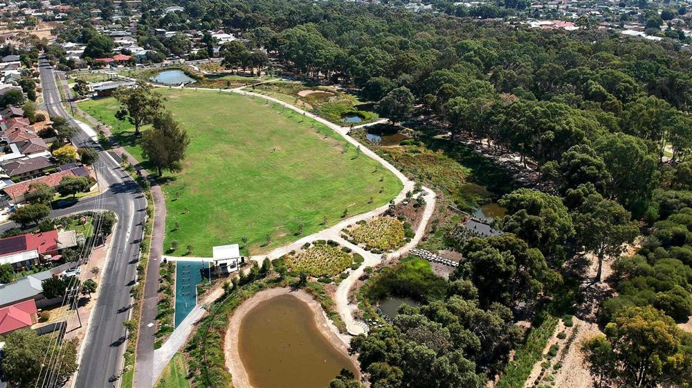 Aerial view of the River Torrens Linear Park with walking trails and wetlands